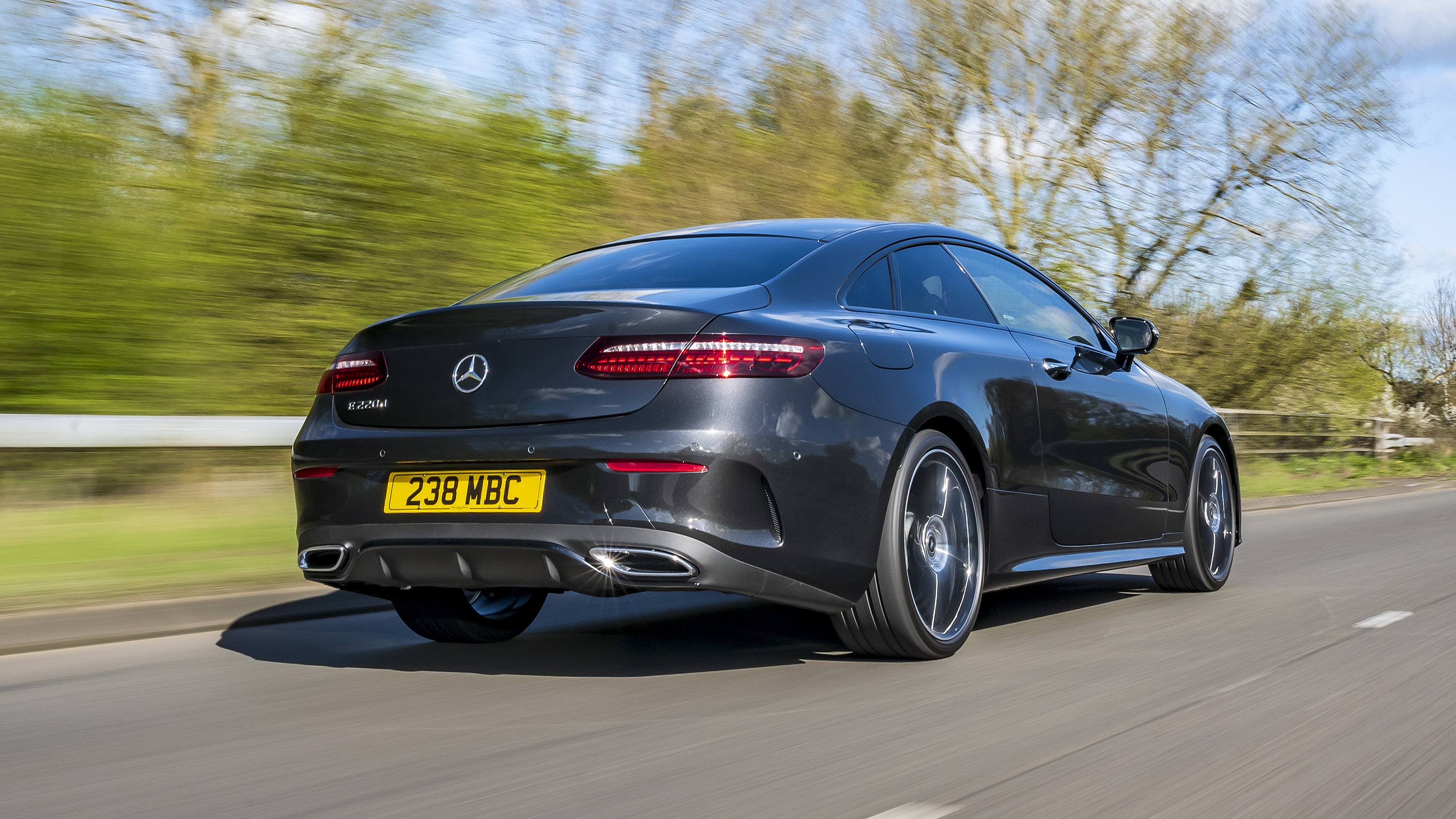 Mercedes E220d Coupe black rear three quarter