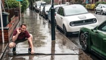 Porsche Taycan 4S EV recharging at home wallbox no driveway on street