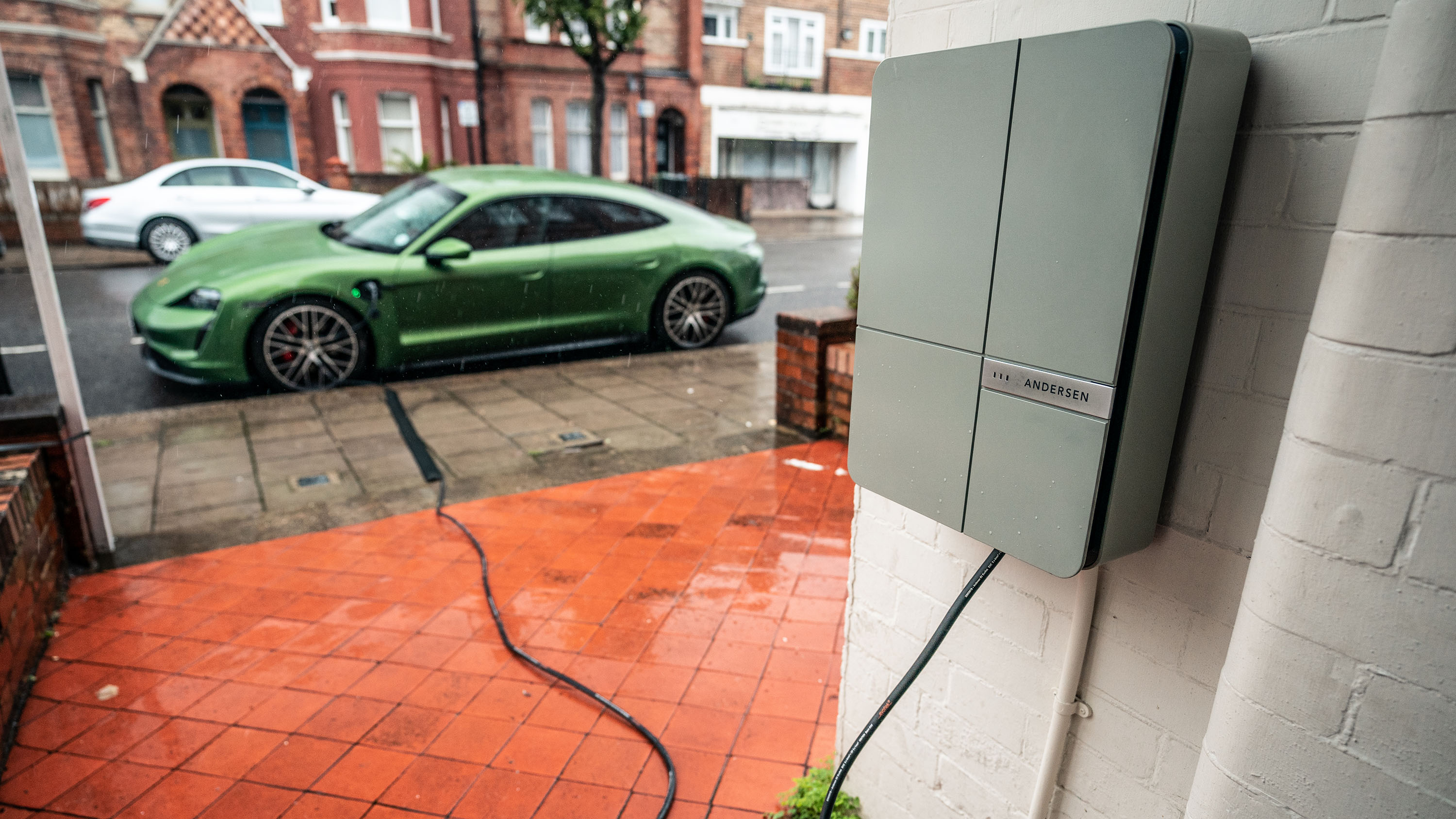 Porsche Taycan 4S EV recharging at home wallbox no driveway on street