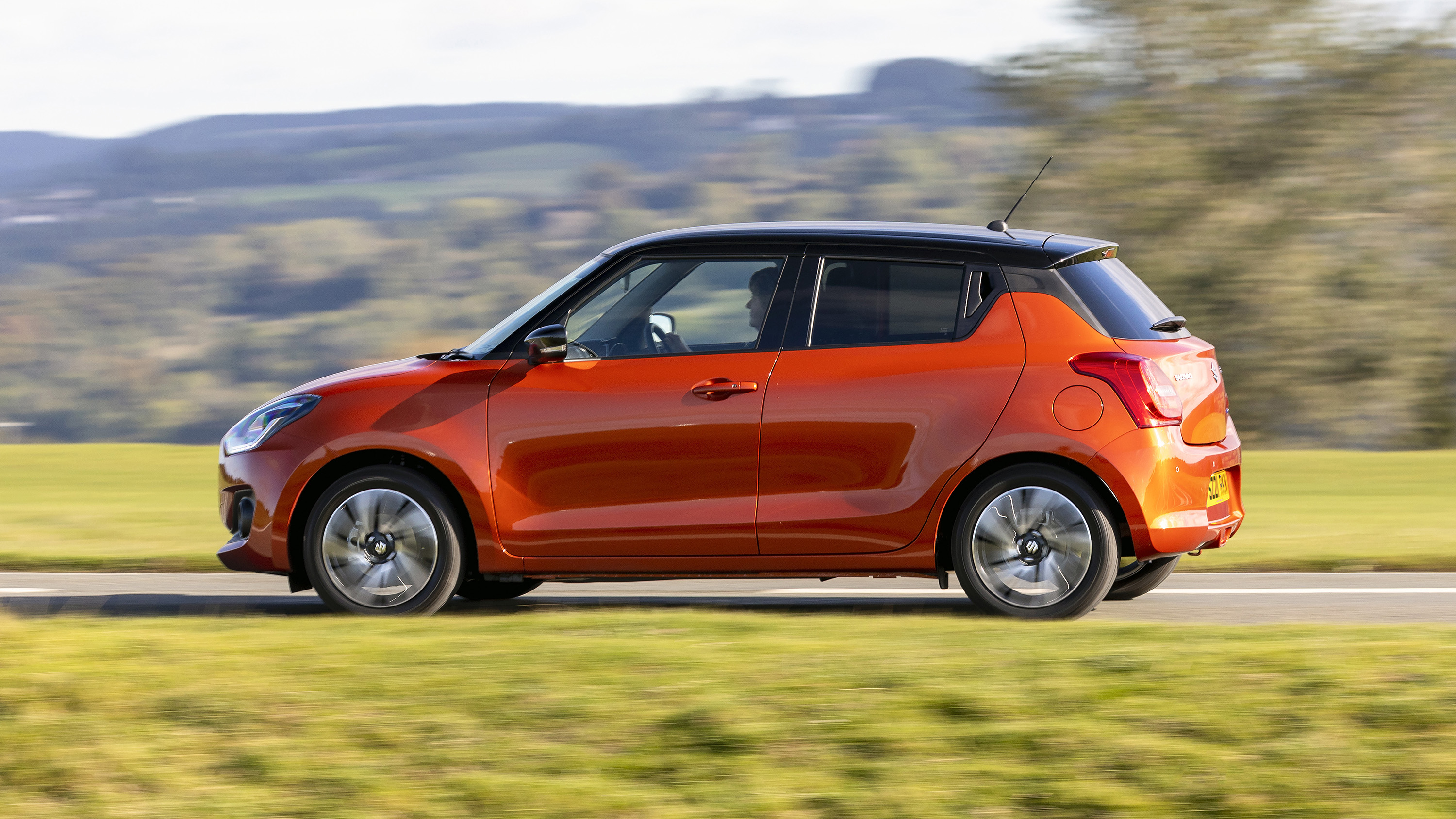 Suzuki Swift hatchback orange and black