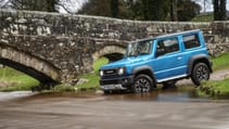 Suzuki Jimny in a river