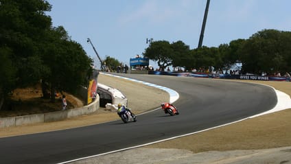 Valentino Rossi passes Casey Stoner on the Corkscrew at Laguna Seca 2008