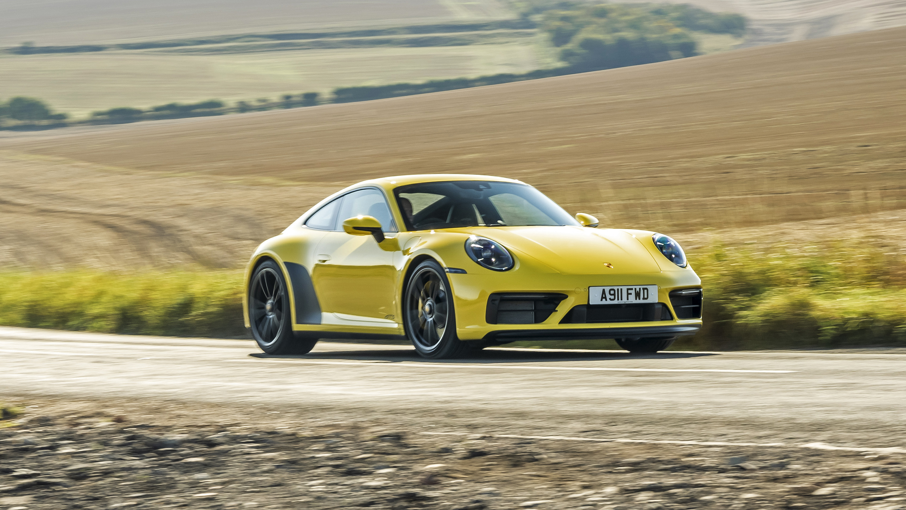 Porsche 911 Carrera 4 GTS coupe yellow