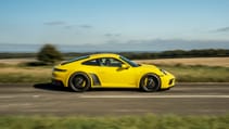 Porsche 911 Carrera 4 GTS coupe yellow side profile