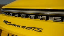 Porsche 911 Carrera 4 GTS coupe yellow badge