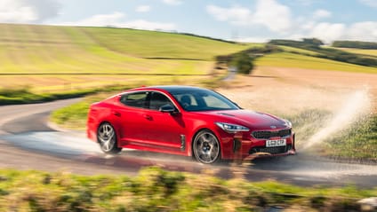 Kia Stinger GT cornering on road