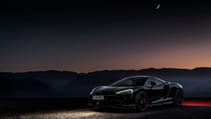 McLaren GT black at nighttime