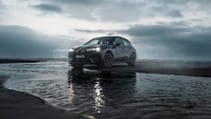 BMW iX EV front three quarters in the sea