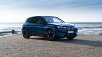 BMW iX SUV static front three quarters