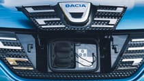 Dacia Spring charge port detail in the grille