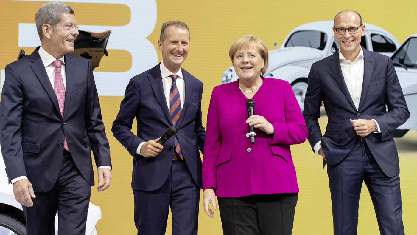 Former Volkswagen CEO Herbert Diess with Angela Merkel