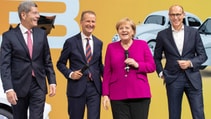 Former Volkswagen CEO Herbert Diess with Angela Merkel