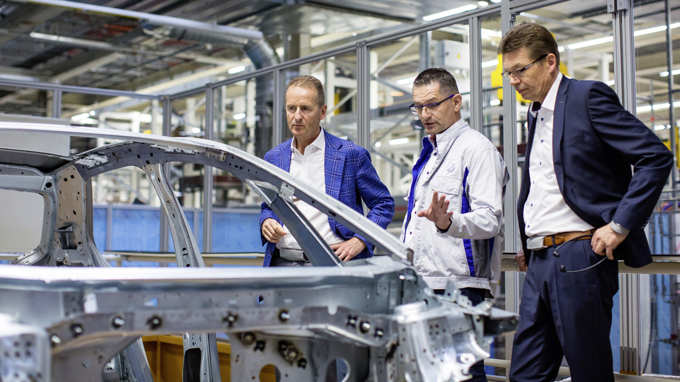 Former Volkswagen CEO Herbert Diess touring a factory