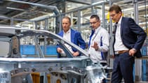 Former Volkswagen CEO Herbert Diess touring a factory