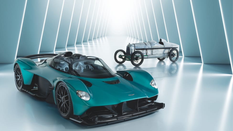 Aston Martin Valkyrie sits in the foreground of a high-res image with a 1923 Aston Martin Razor Blade in the background