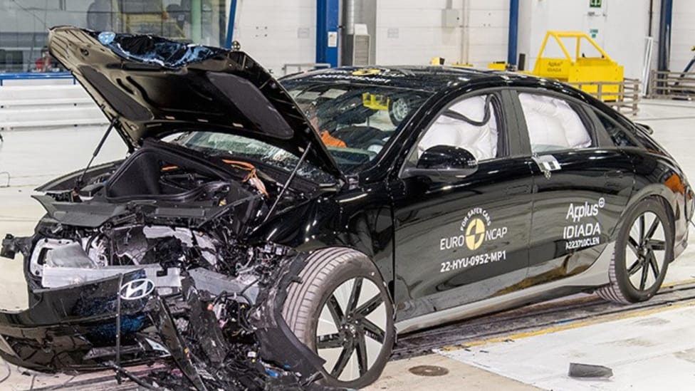 Passenger side front angled shot of Hyundai IONIQ 6 after front barrier test with bonnet crumpled