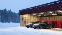 Porsche Macan sitting in a snowy landscape, charging in an open garage