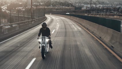 Cityscape shot with UMC-063 XP Zero being ridden on an all-but-empty road