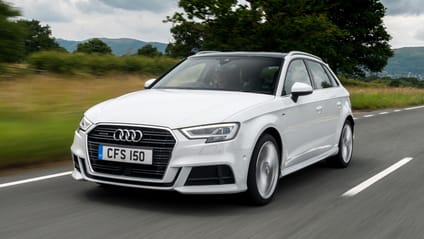 Driving shot of white Audi A3 taken from passenger side front