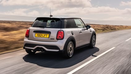 Rear driving shot of BMW Mini hatchback on cloudy day