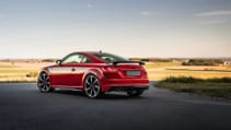 Rear static shot of red Audi TT Final Edition with a sunset backdrop