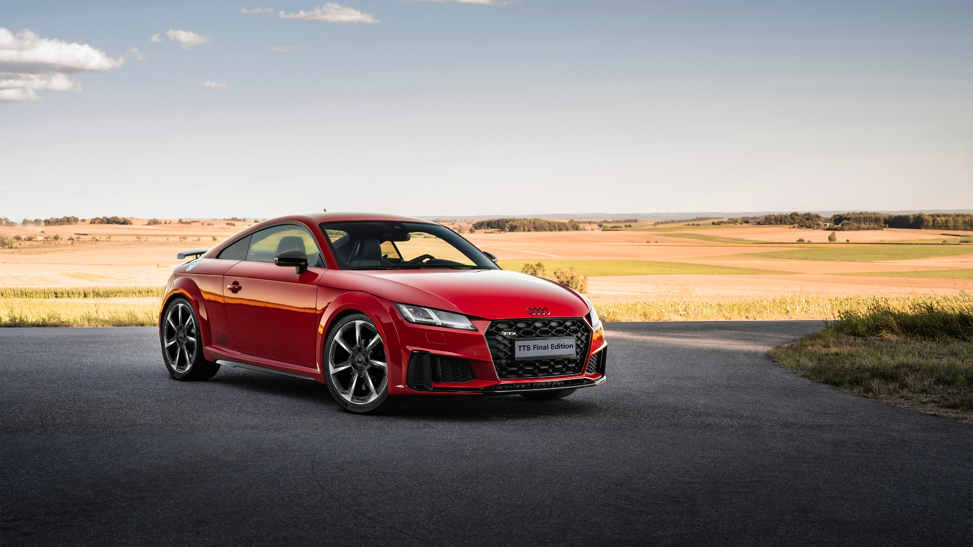 Static shot of red Audi TT Final Edition with a sunset backdrop