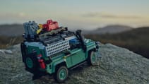 Lego classic Land Rover Defender 90 in off-road custom build sitting on a rock