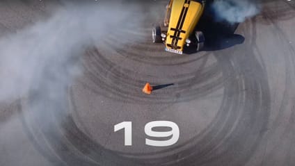 19 graphic on tarmac from Birds Eye view with Chris Hoy's Caterham