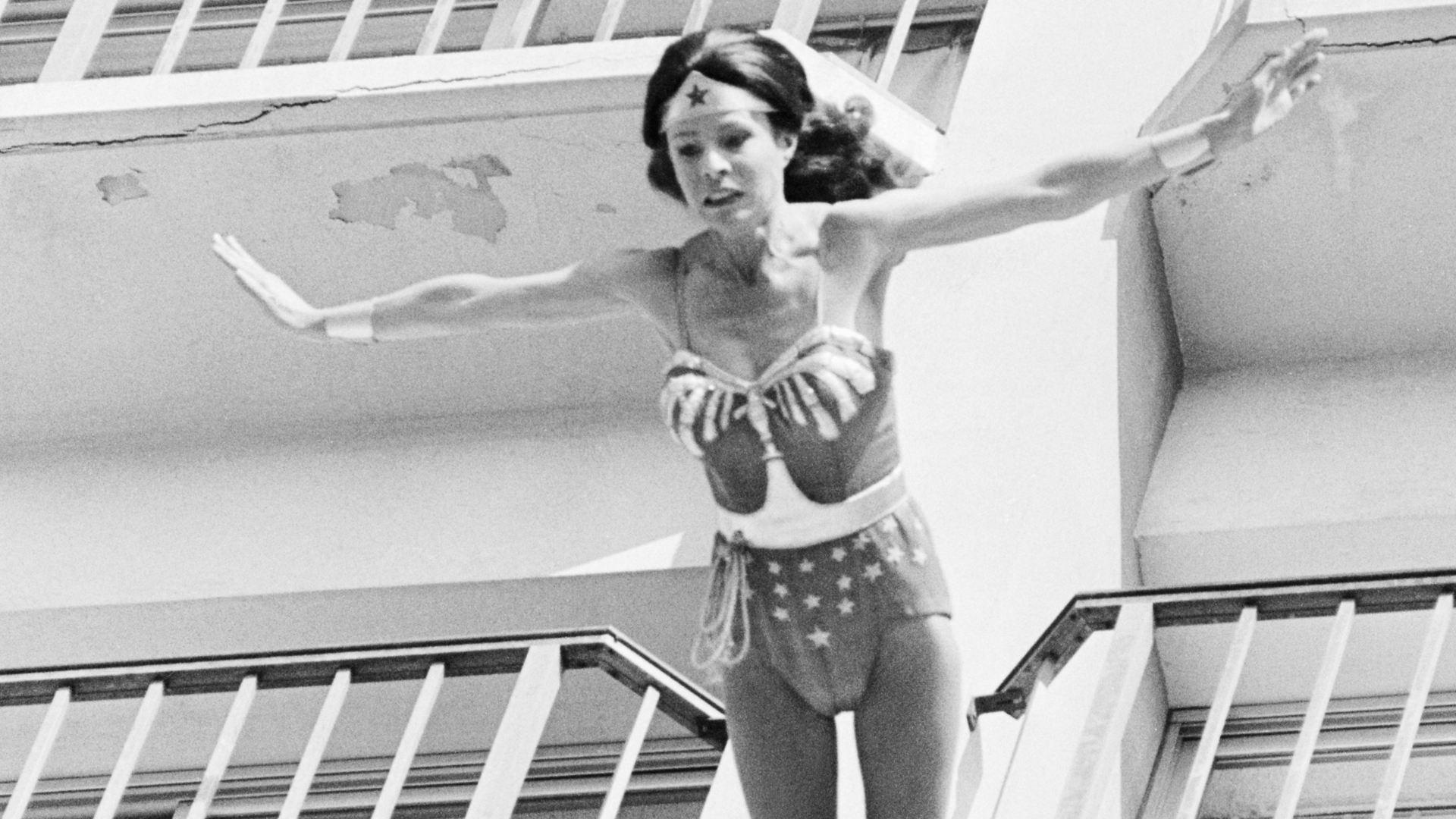 Stunt woman Kitty O'Neil dressed as Wonder Woman for mid-jump off a balcony