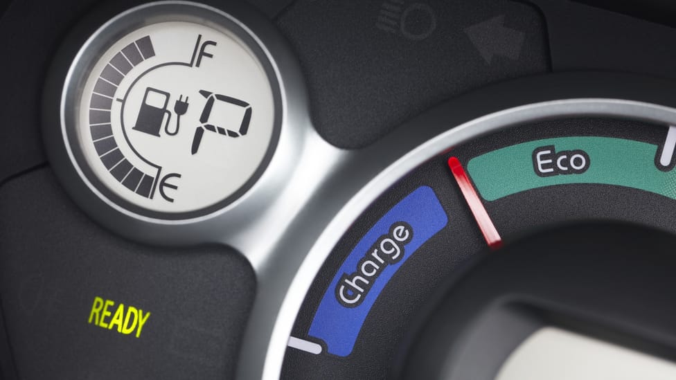 The dash of a Peugeot iOn close up showing State of Charge, Eco and Power gauges