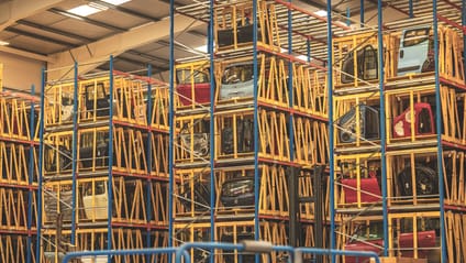 Secondhand door panels stacked in a warehouse