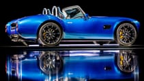 2024 AC Cobra GT Roadster in studio shot with dark background and mirror floor