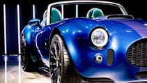 Close up on driver side body line and headlight of AC Cobra GT Roadster