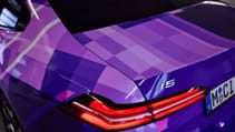 Close up of rear taillight, 8-bit purple wrap on new BMW 5-series