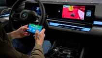 Driver playing solo game on Airconsole in BMW 5-series