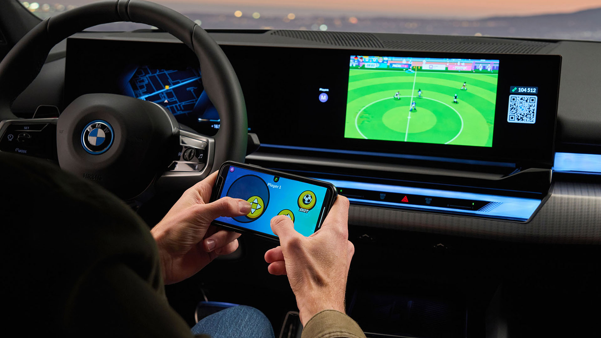 Driver playing solo footy game on Airconsole in BMW 5-series