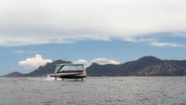 Foiling tech of the BMW Tyde Icon battery-electric boat, hovering on the water