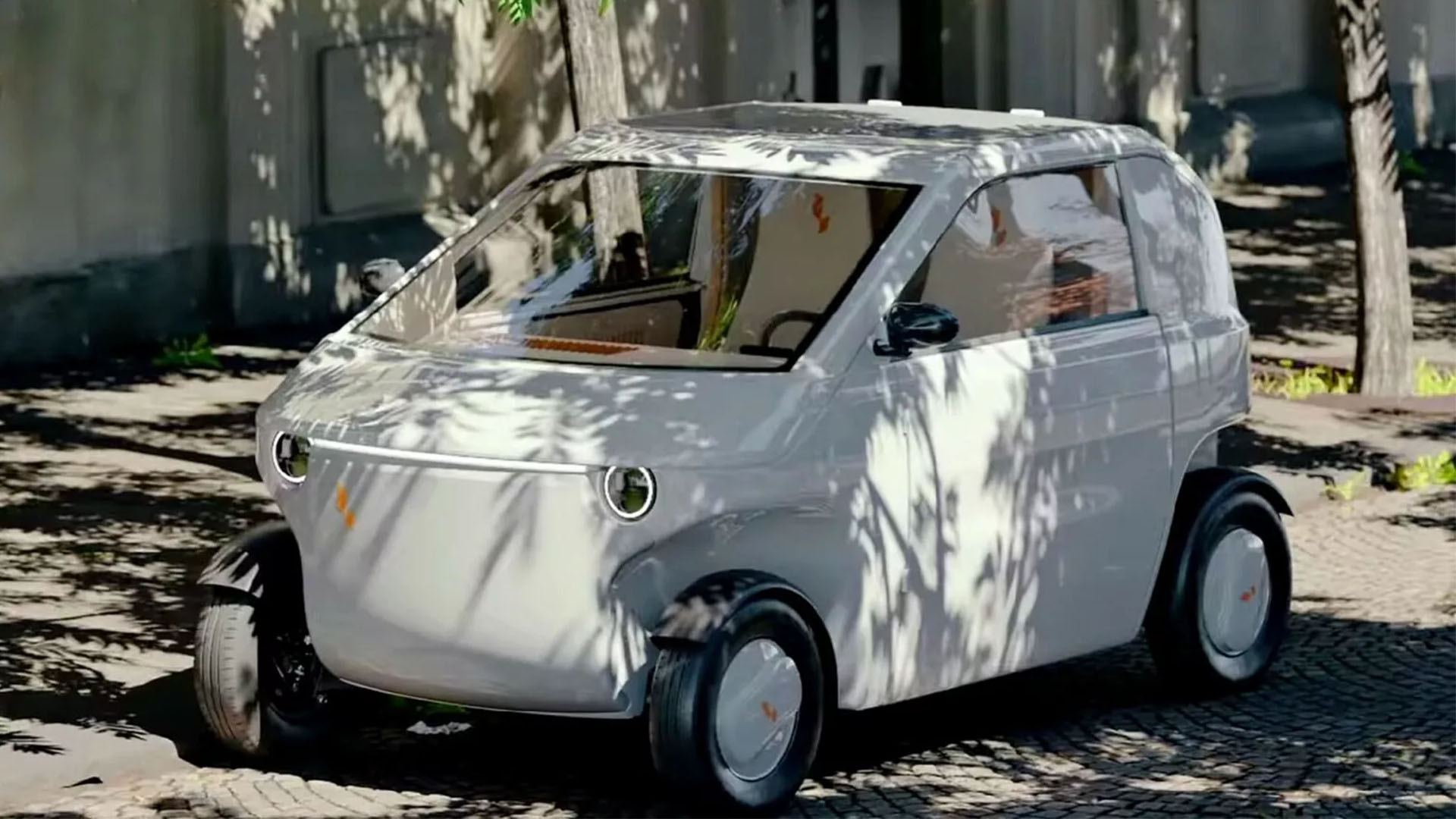 Luvly O 'flat-pack' delivered concept car parked under a tree