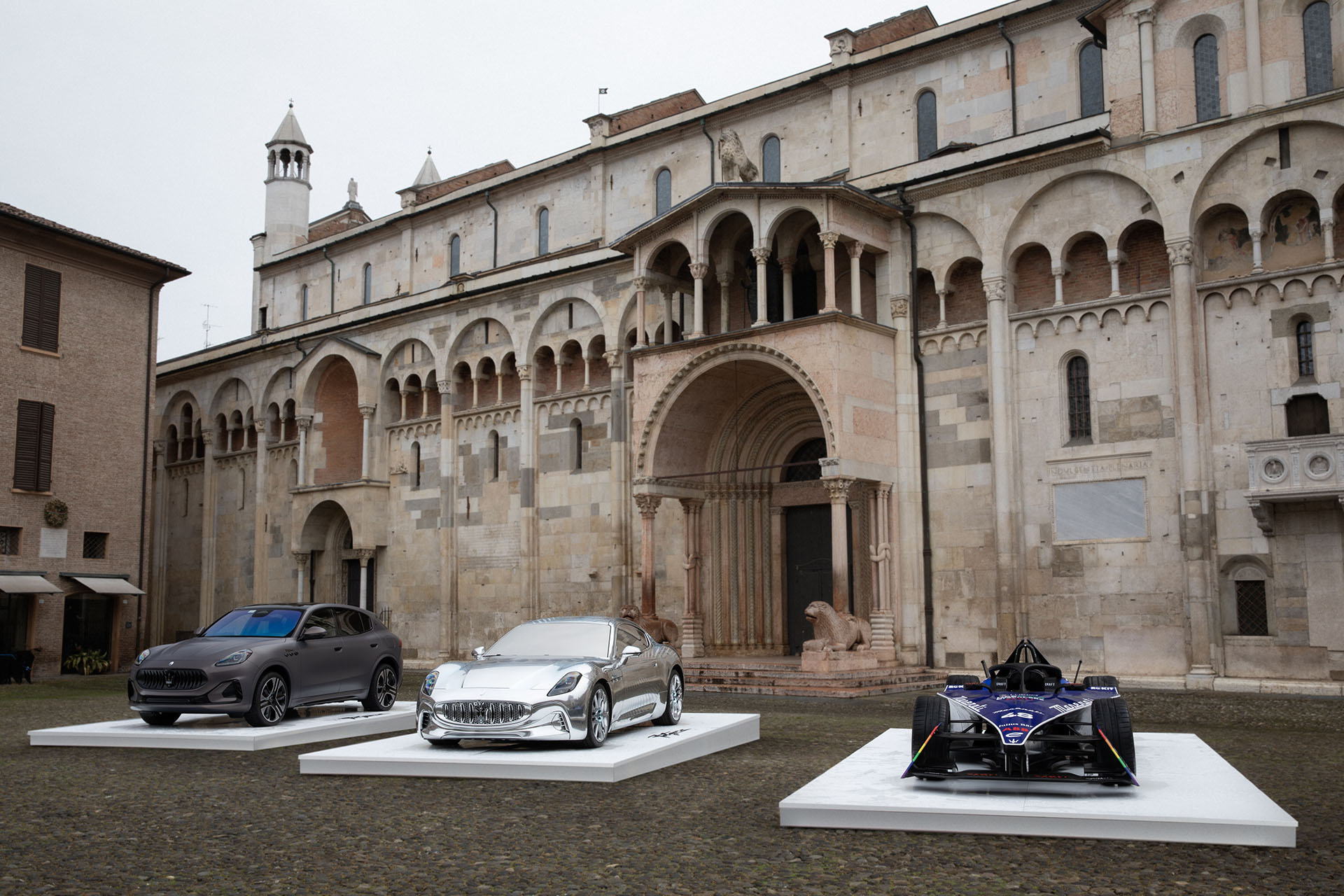 Wider shot of Maserati range in Piazza Grande, Modena