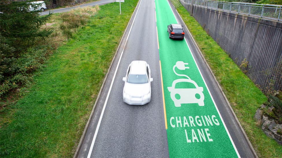 A road showing a dedicated lane for charging EVs