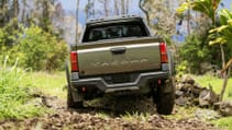 Driving shot of rear of Toyota Tacoma