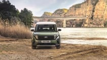 Static external shot of Ford E-Tourneo Courier with bridge backdrop