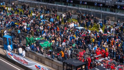 There's a chance to ogle the race cars on the grid walk