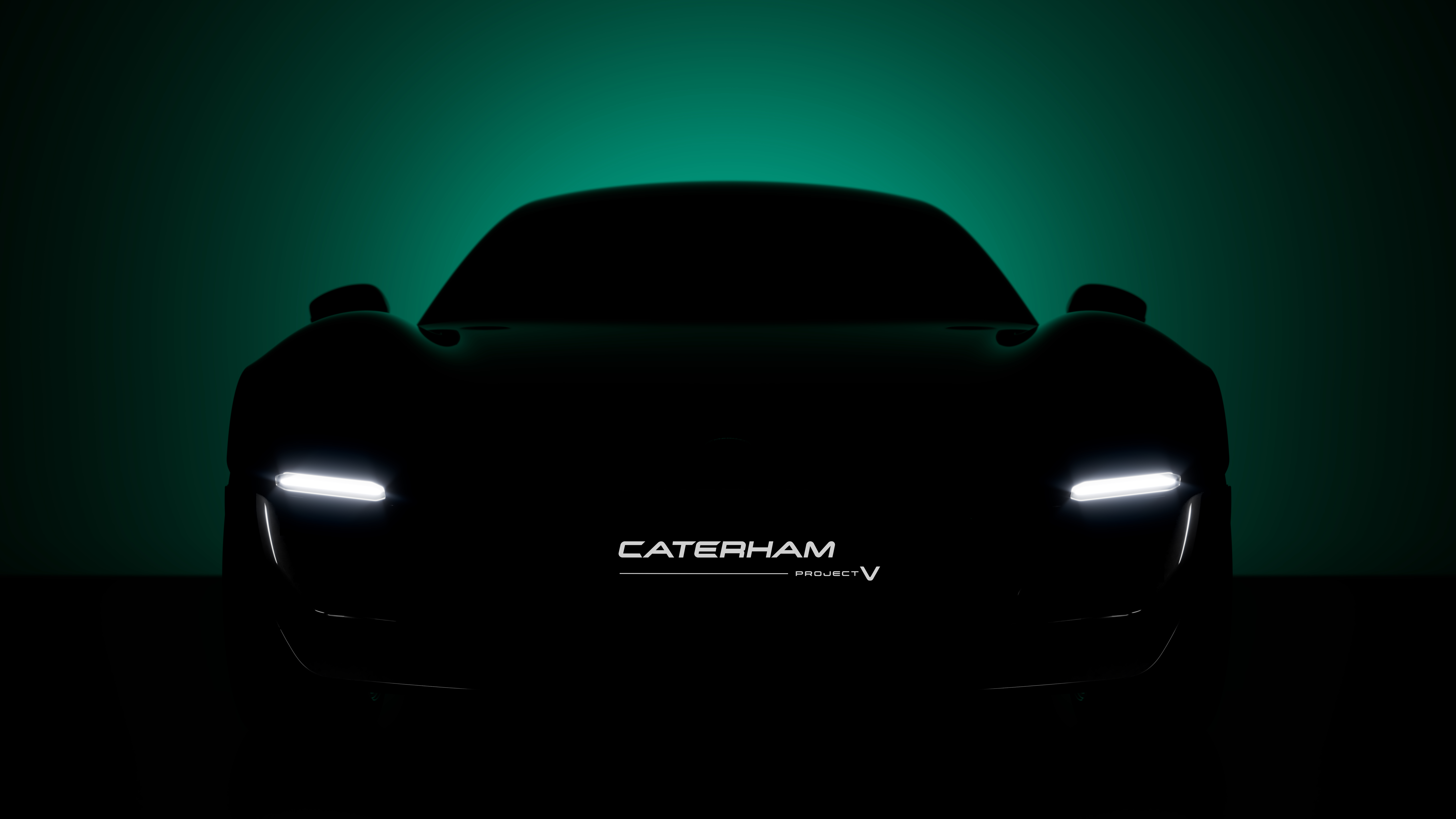 Shadowy teaser of Caterham's Project V with headlights and numberplate illuminated