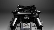 Dash-cae carbon-fibre chassis in static studio shot - from head on