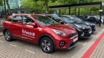 Kia vehicles with Fetch decals on door parked up ready to be hired