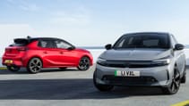 Two Vauxhall Corsa sit in the frame in a static shot