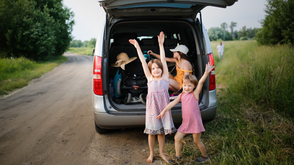 A family on holiday, parked by the roadside