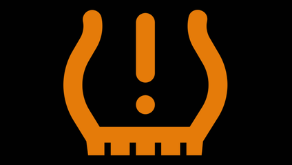 Tyre pressure monitoring alert icon in orange