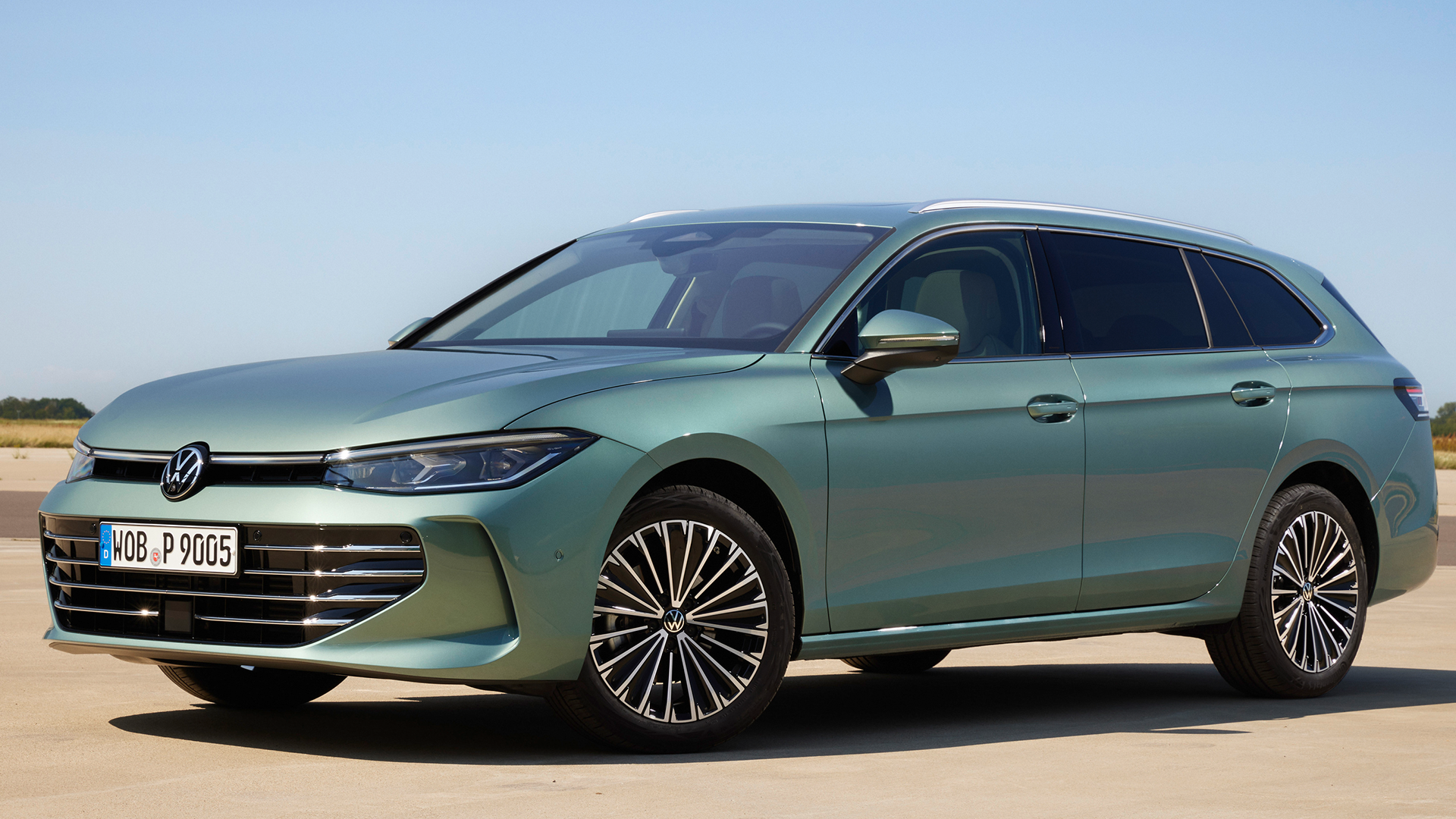 The new 2024 VW Passat Variant in green in a static shot with a blue sky background